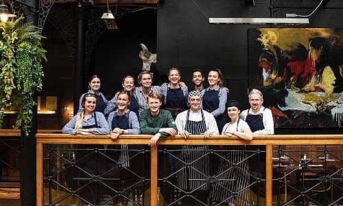 Staff photo taken on the balcony of the Farmgate Cafe in the Englishin Market Cork 